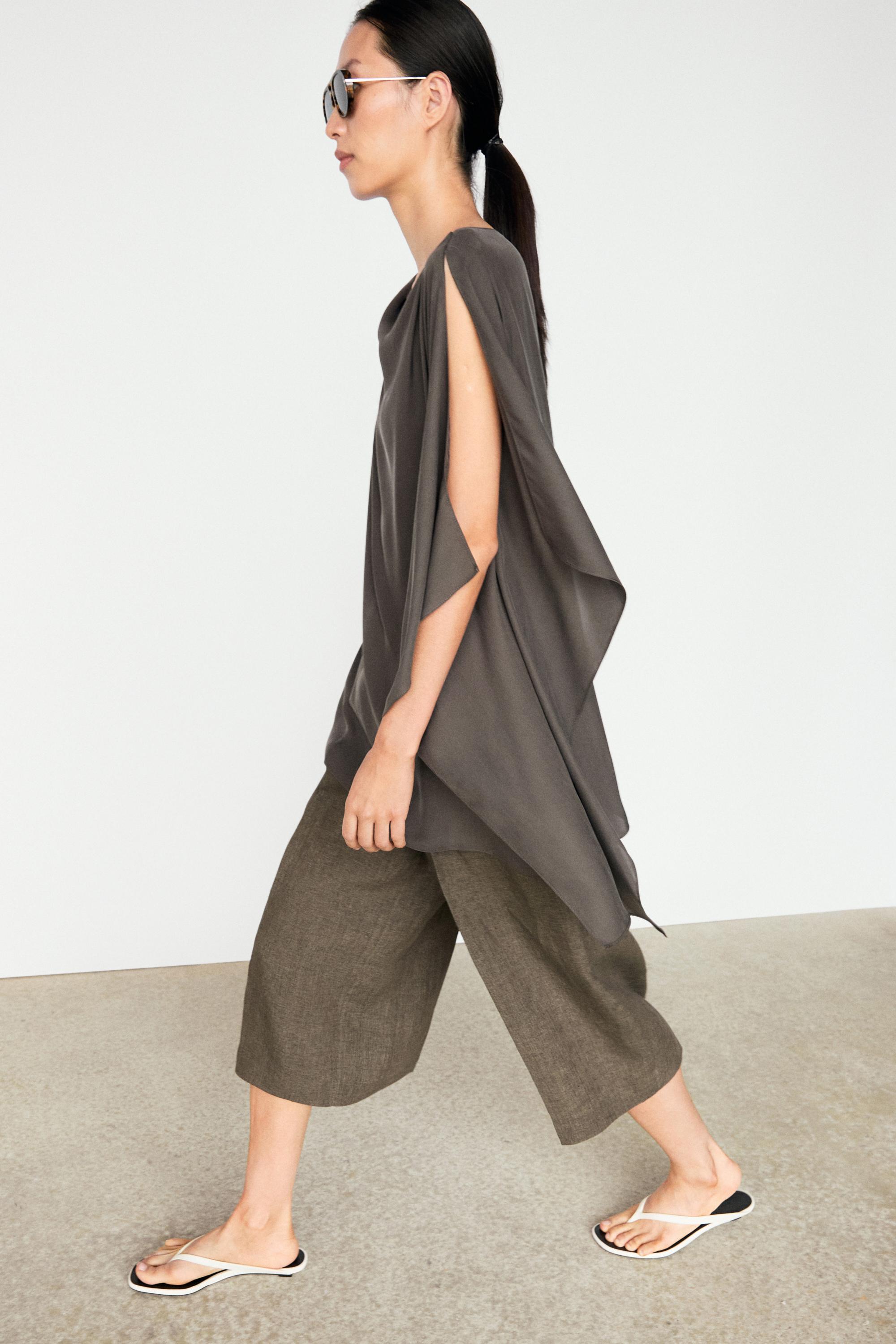 Asymmetric flowing cape top